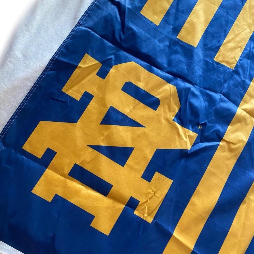 Notre Dame blue and gold striped flag